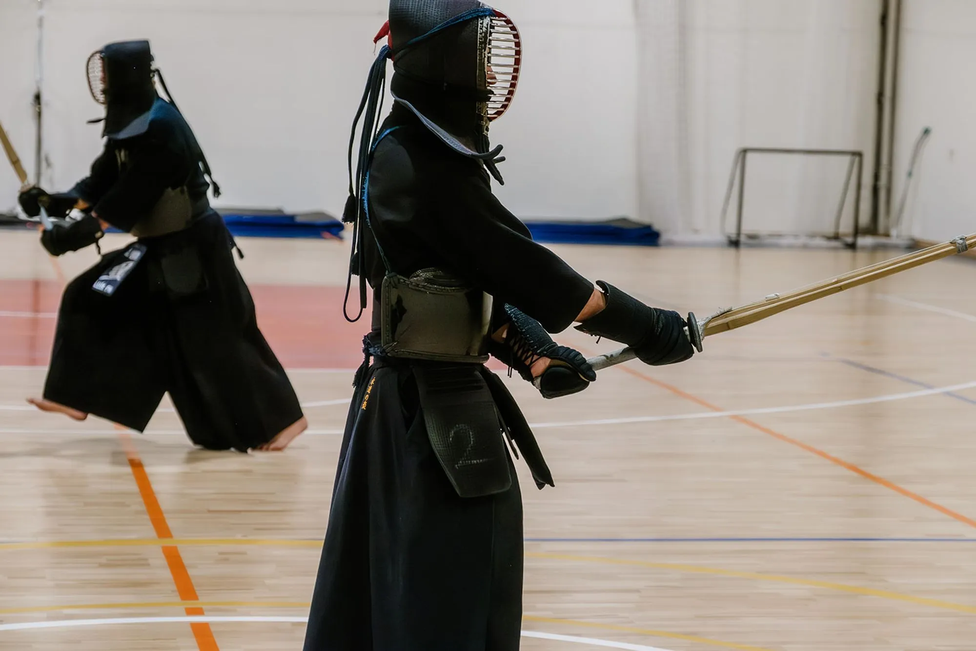 Two kendoka close together, one delivering a strike