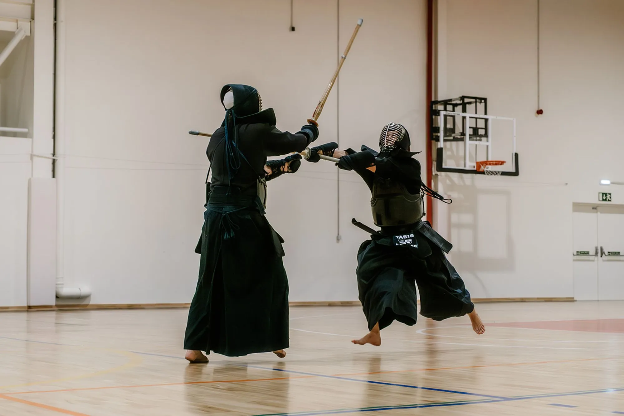 Two kendoka holding distance in kamae