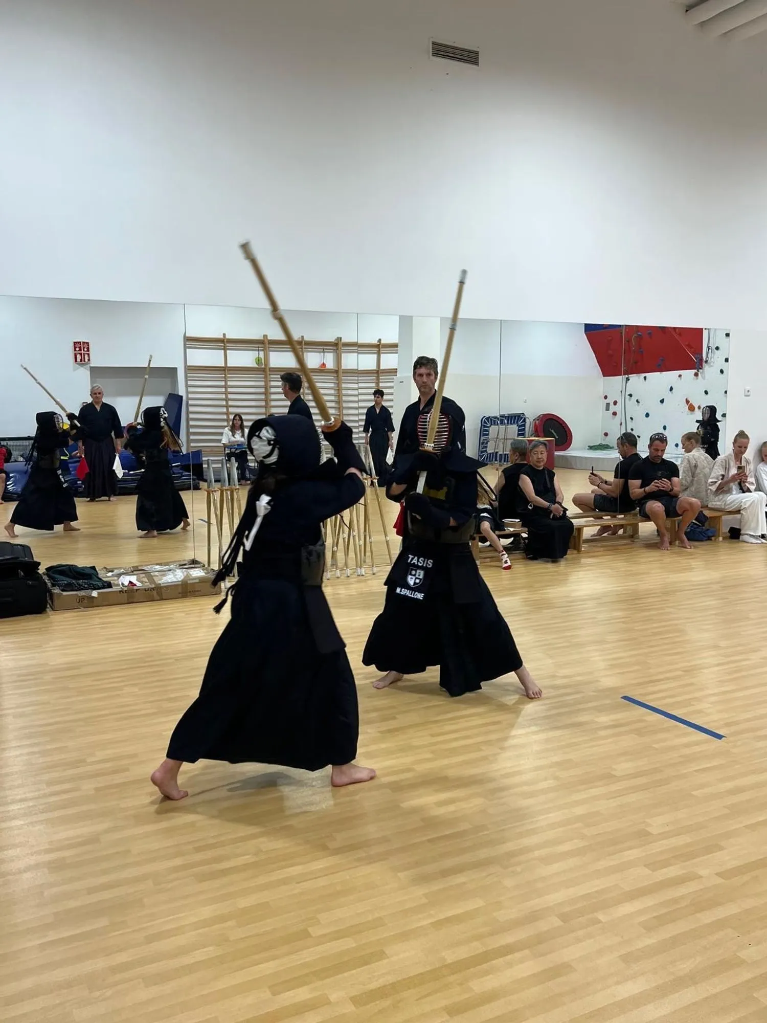 A match watched by seated spectators