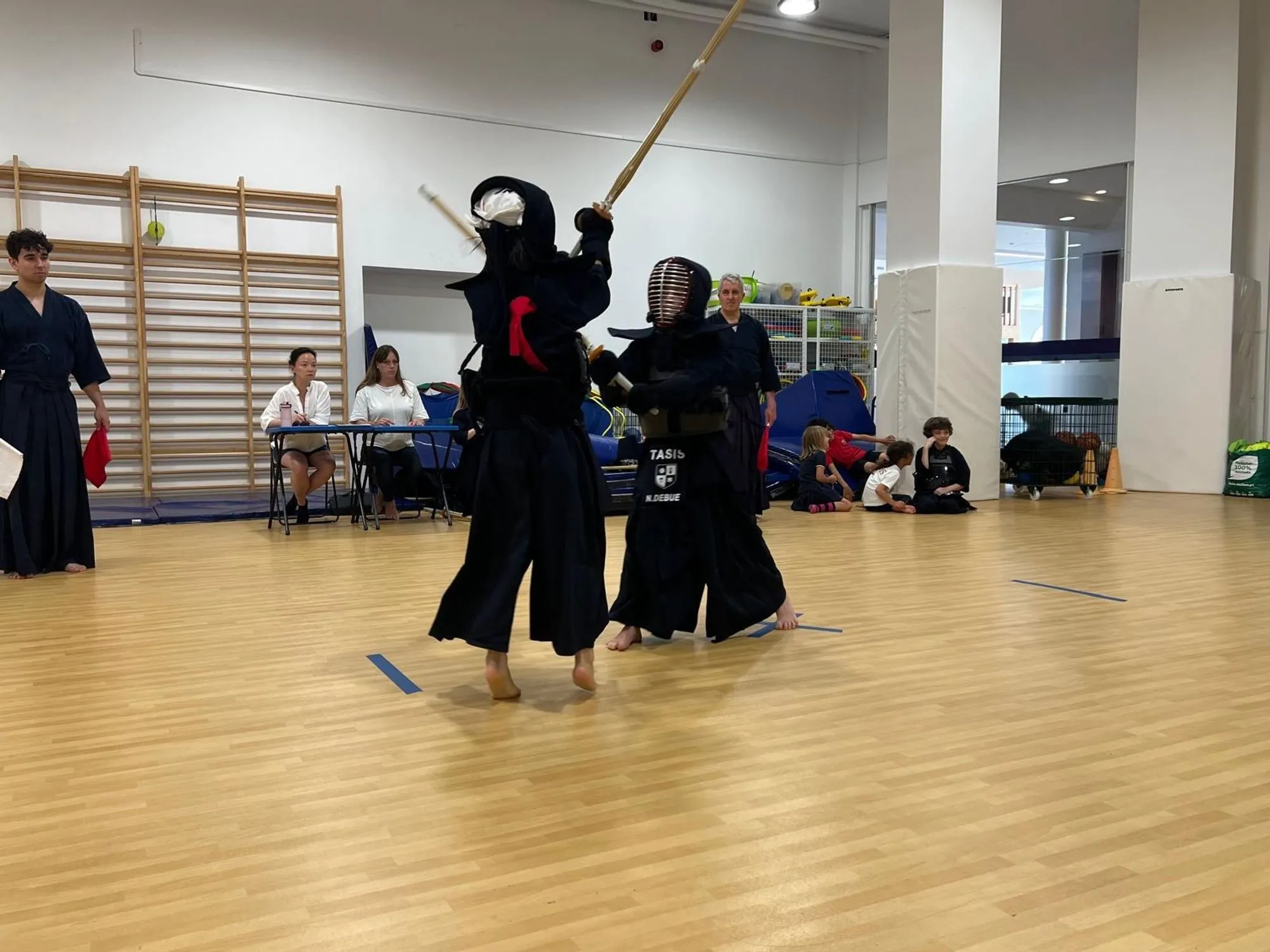 Kendoka moving through the hall between matches