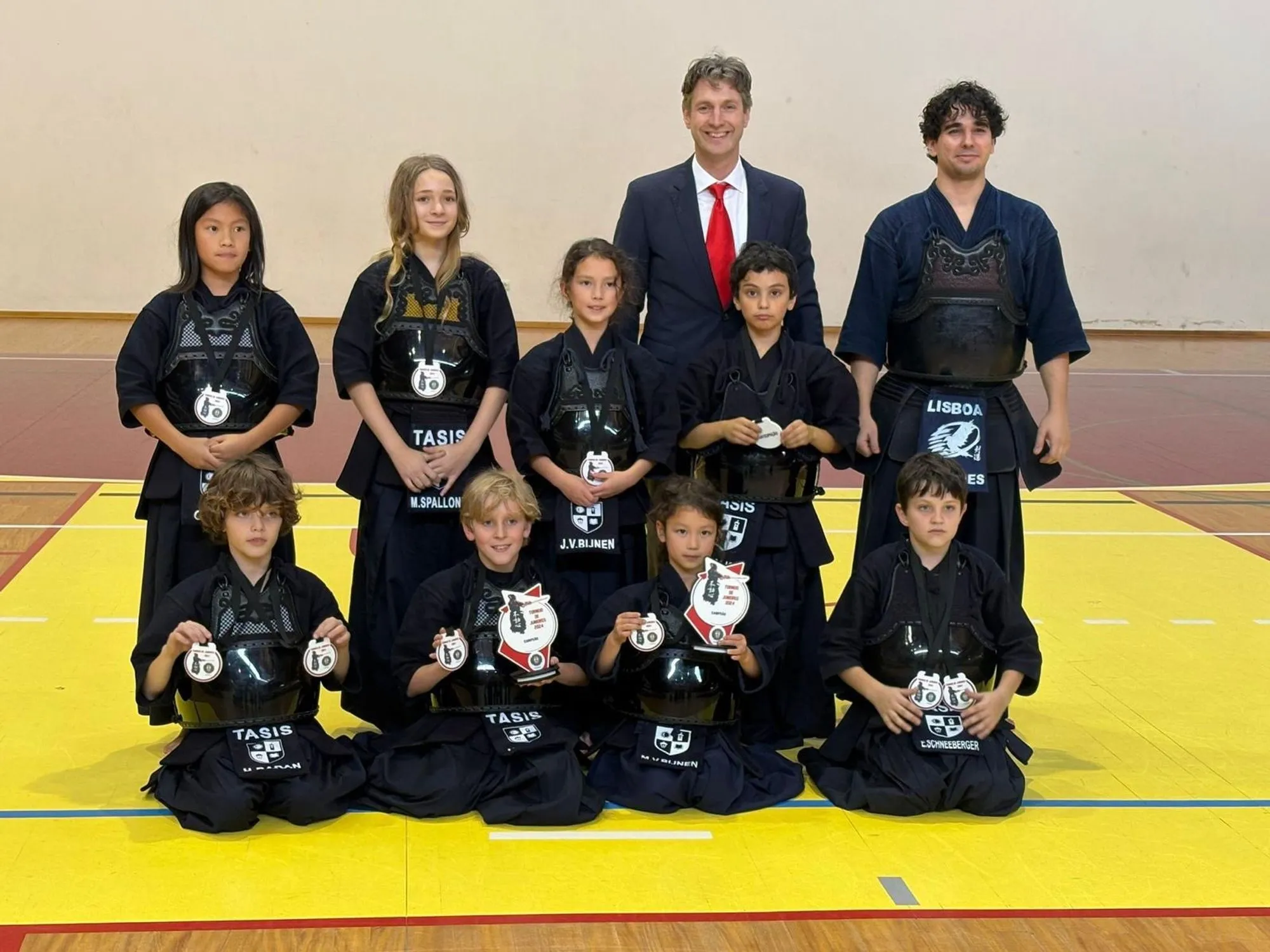 Team photo after the competition, medals and certificates