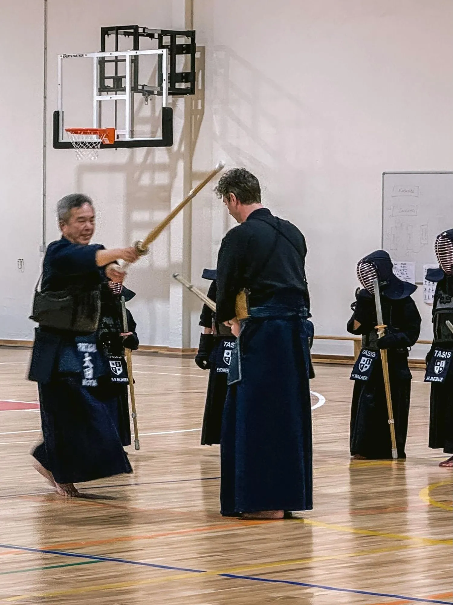 Two adult kendoka training together