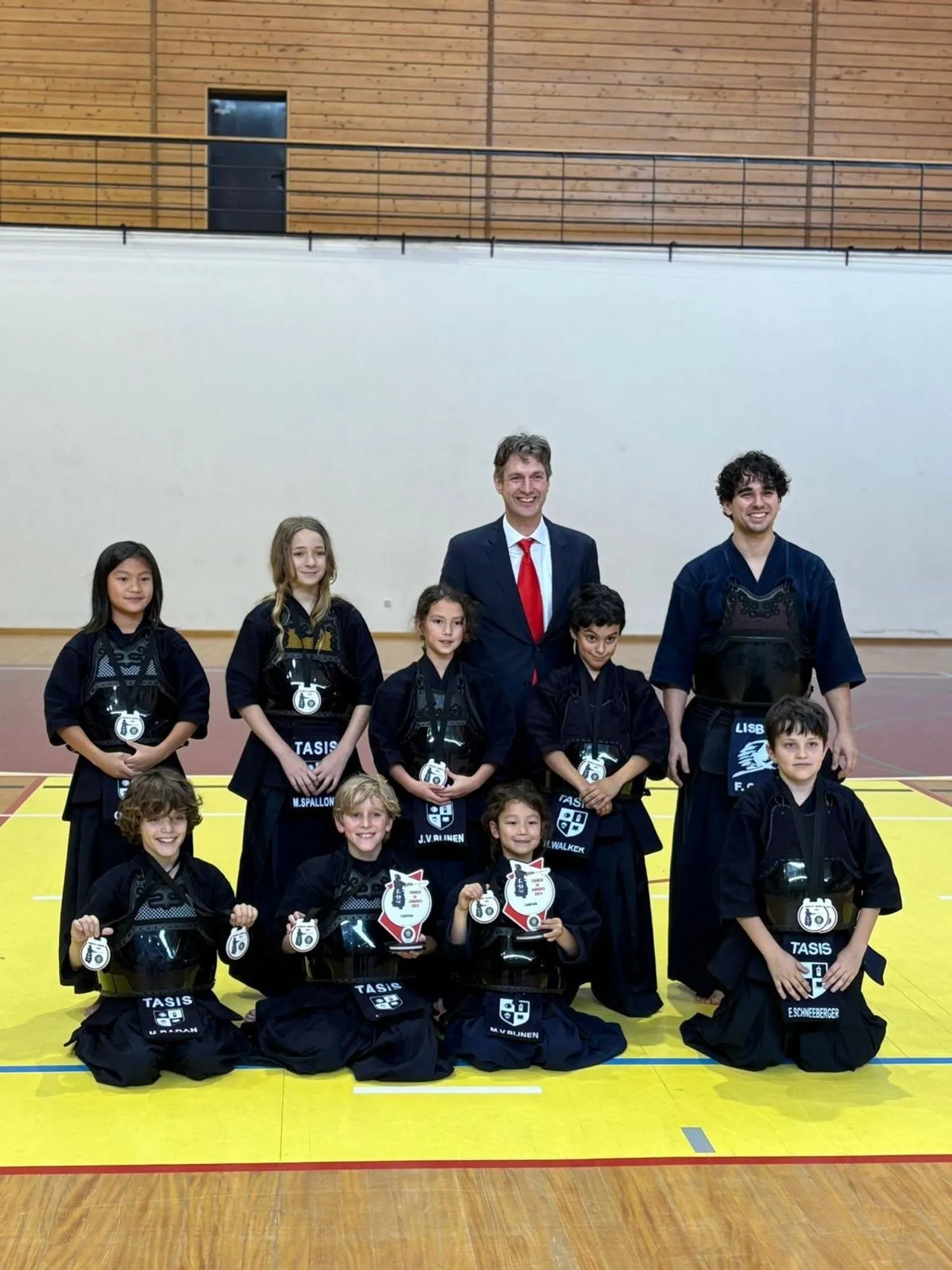 Team photo with the club members and their awards