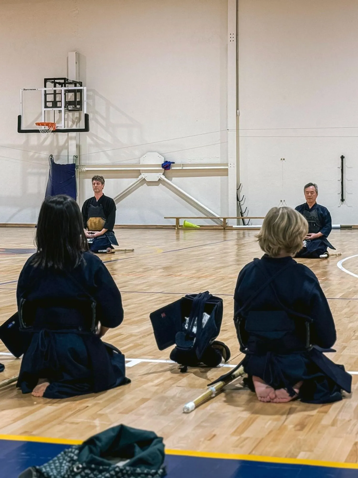 Kendoka seated before the opening ceremony, seen from behind