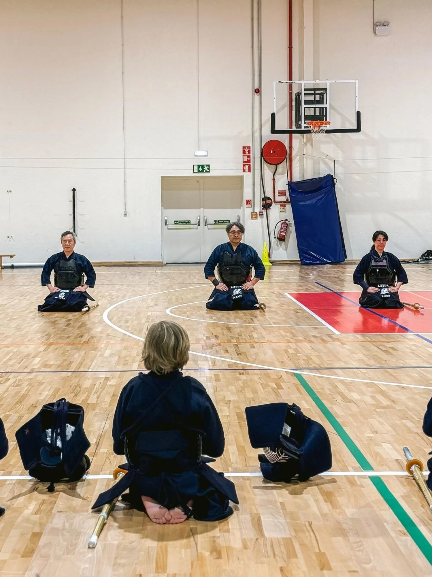 Kendoka kneeling in seiza before practice