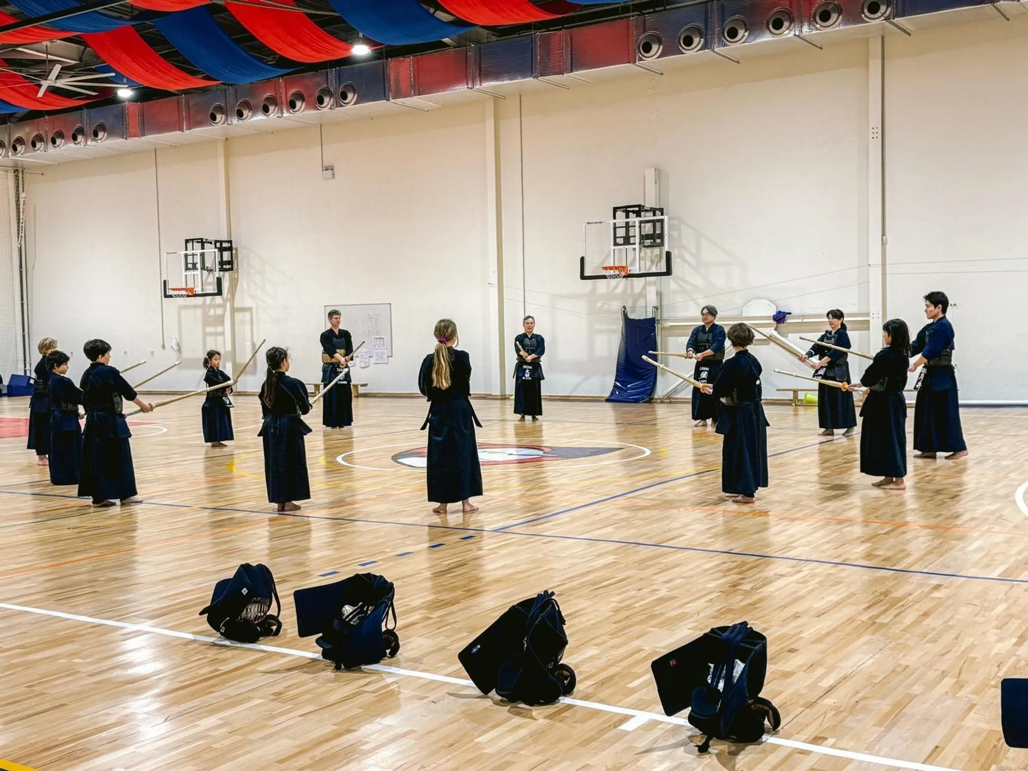 Kendoka standing in line across the hall