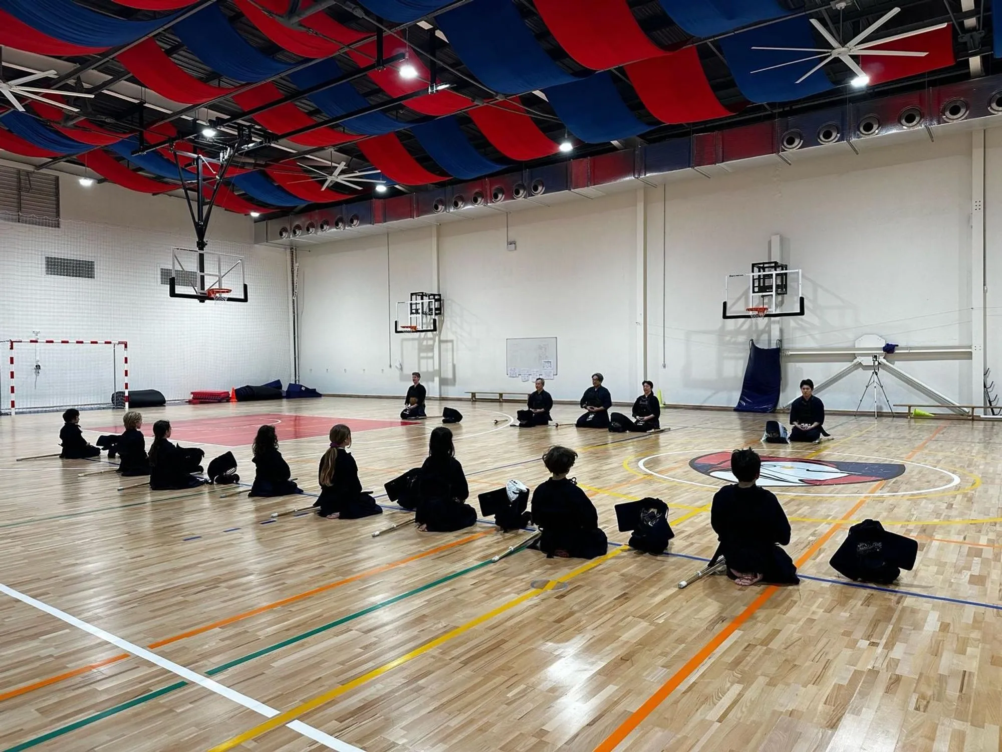 The group seated together in the hall