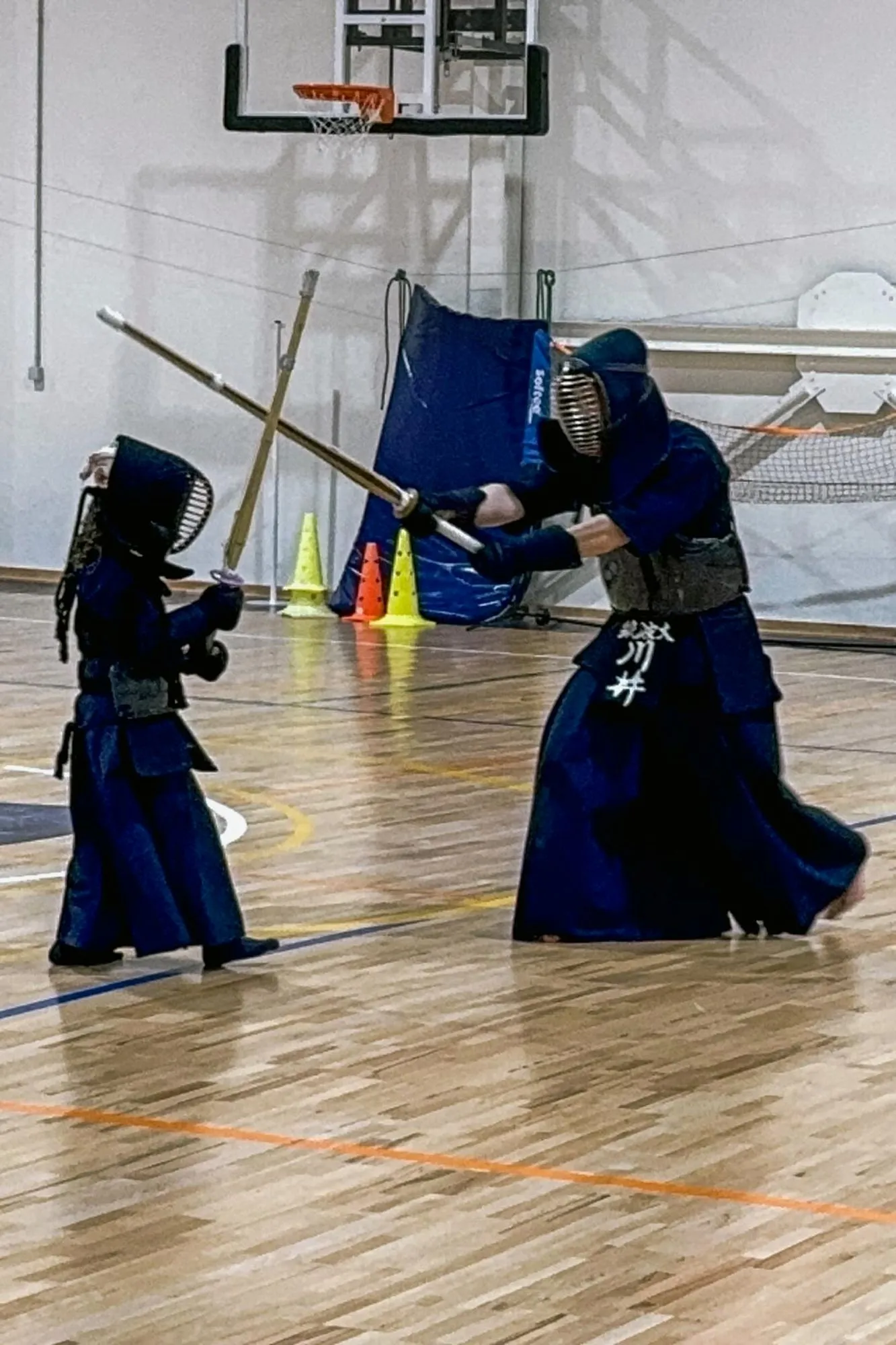 Two kendoka in a close exchange of strikes
