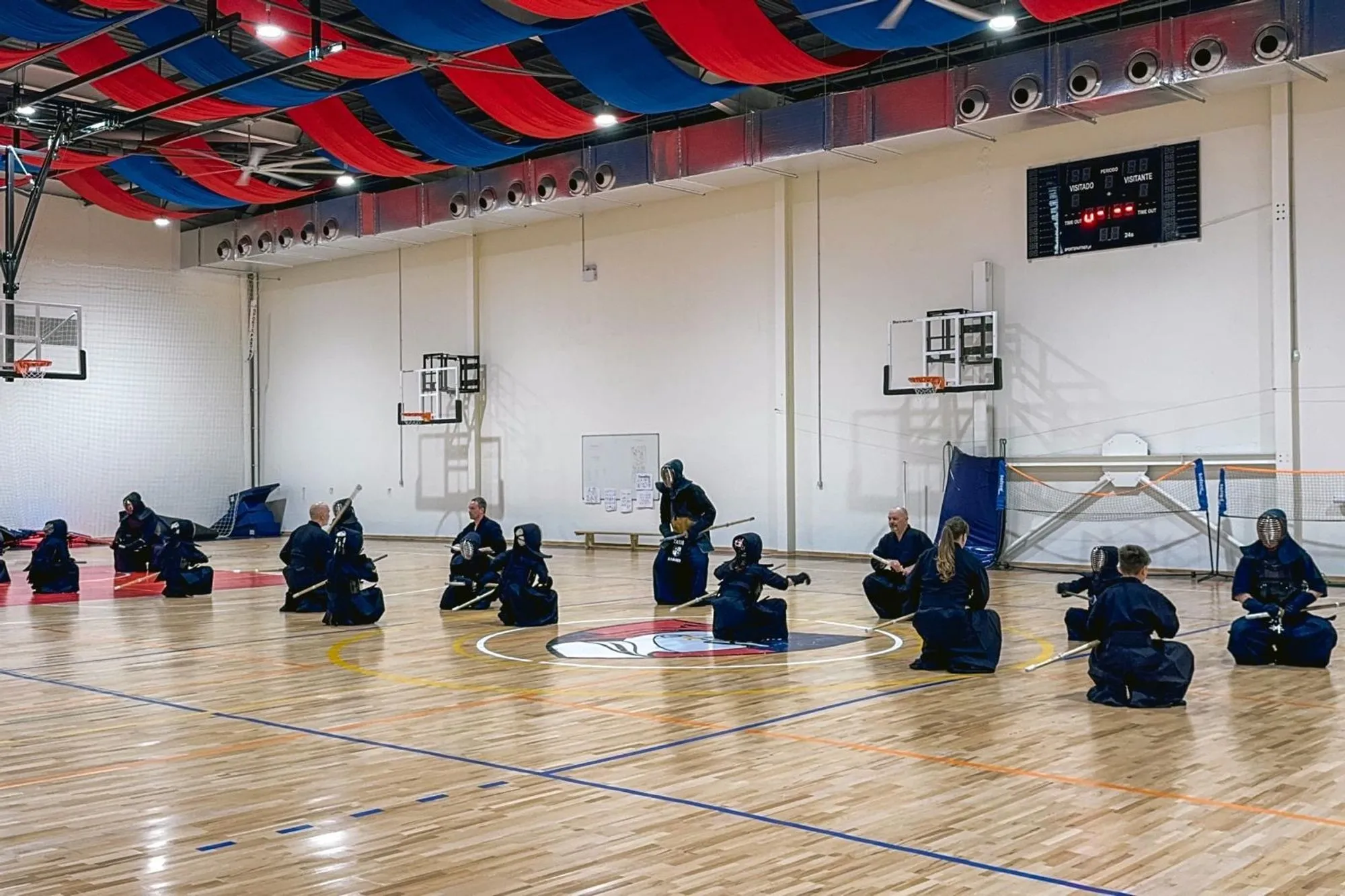Wide view of the hall with many kendoka training